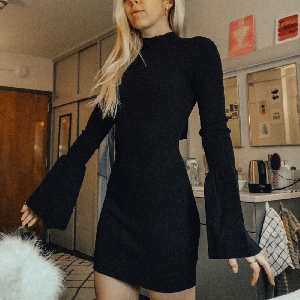 Black formal dress, tie back and flowy sleeves.